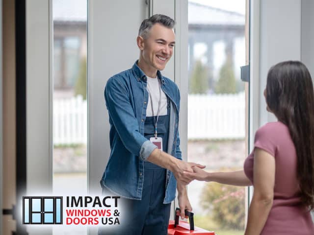 door repair service contractor communicating shaking hands with woman