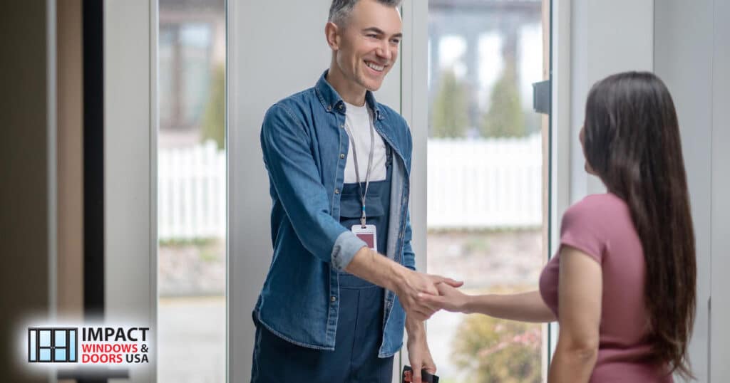 door repair service contractor communicating shaking hands with woman